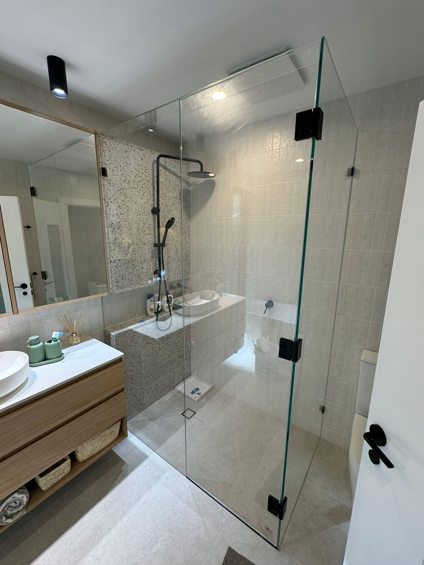Corner Shower with Black Hardware