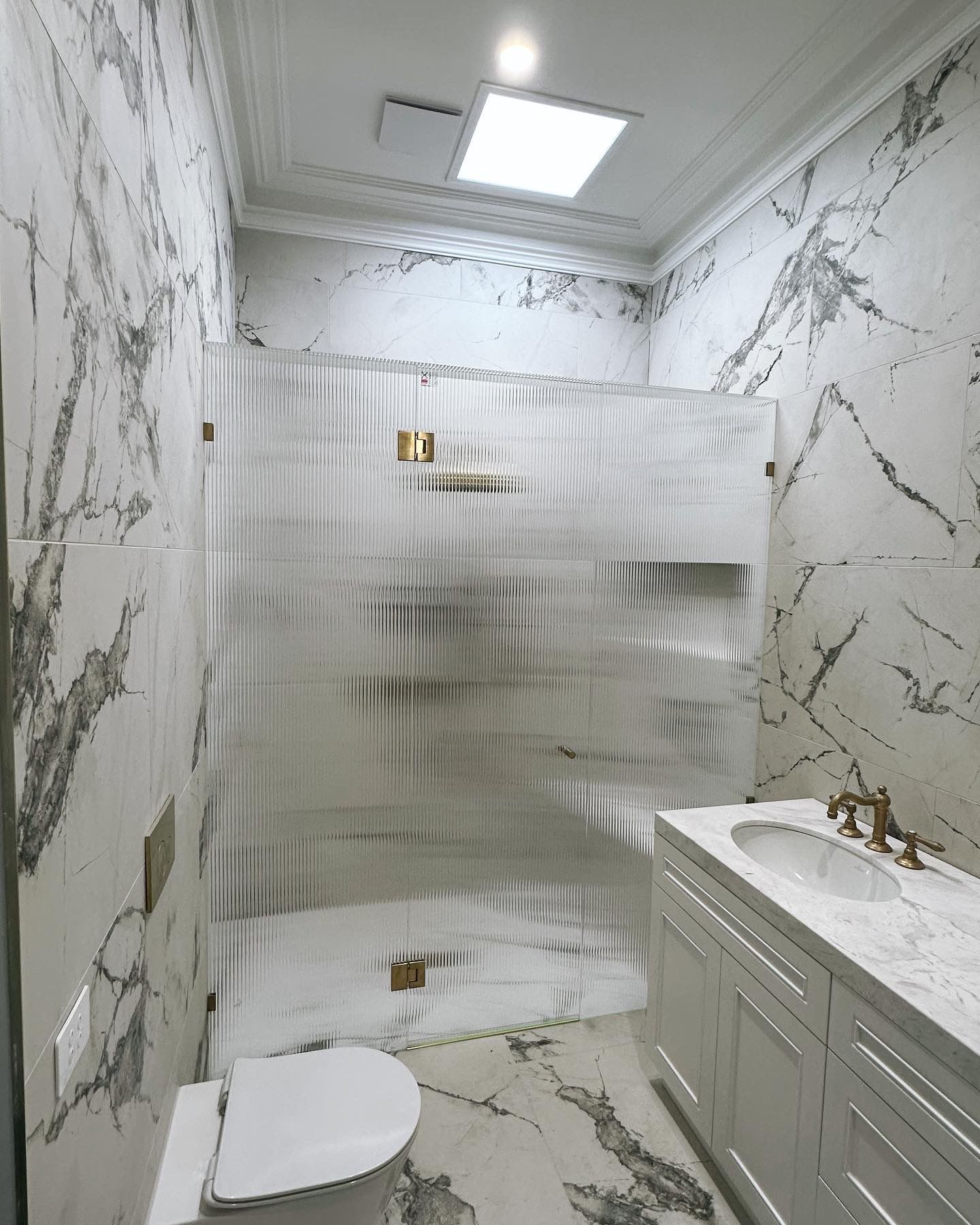 Fluted Glass Shower with Brushed Brass